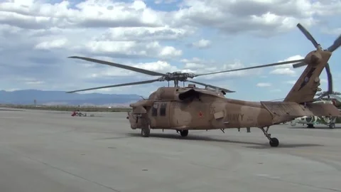 U.S. Navy MH-60 Seahawk with tactical paintwork taxiing at NAS Fallon Stock Footage 275824246