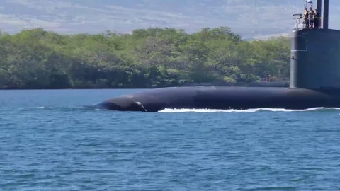 US Navy nuclear powered submarine departing from naval base at Pearl Harbor Stock Footage 82943262