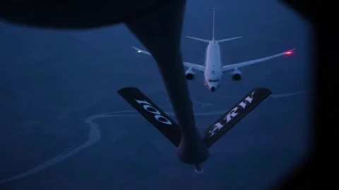 U.S. Navy P-8 Poseidon aircraft approaching boom during aerial refueling mission Stock Footage 270748858