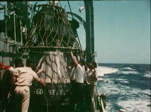 U.S. Navy recovery crew remove transportation net from space capsule Video stock 262444838