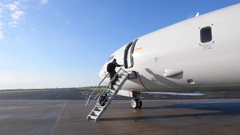 U.S. Navy sailor opening door of P-8 Poseidon and boarding plane Vídeos de archivo 110732233