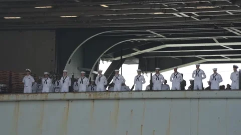U.S. Navy sailors aboard USS Harry S Truman (CVN 75) man the rails on arrival Stock Footage 209493374