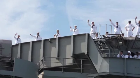 U.S. Navy sailors wave from deck of USS Harry S Truman on return from deployment Stock-Footage 209493290