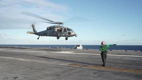U.S. Navy SH-60 Seahawk taking off from flight deck of USS George Washington Stock Footage 258898346