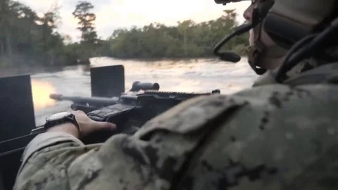 US Navy Special Warfare. Machine Gunner Shoots then Reloads Machine Gun Video stock 121890198