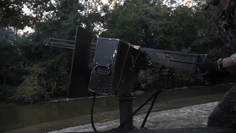 US Navy Special Warfare. Machine Gunner Shoots. Slow motion Video stock 121890307