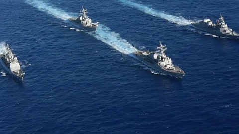 US Navy strike group of guided-missile destroyers and cruiser sail in formation Stock Footage 87126931