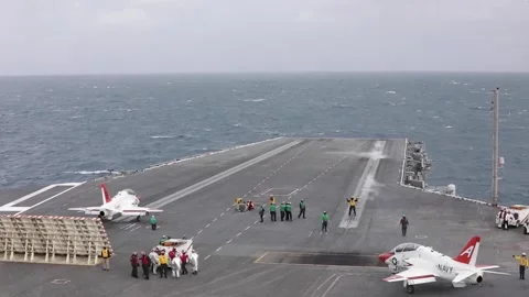 U.S. Navy T-45 Goshawk taxiing on the flight deck of the George H.W. Bush CVN 77 Stock Footage 297066519