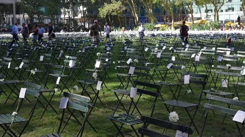 US: New York marks 25th anniversary of 9/11 with 2,753 chairs facing form... Stock Footage 345570691