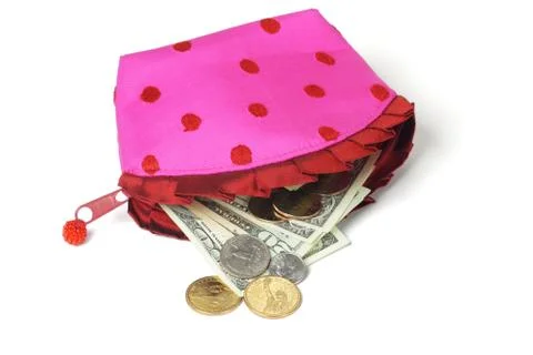 Us notes and coins spilling out from pink purse Stock Photos