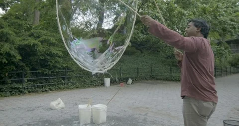 US - NYC - Central Park Bubbles 1 Stock Footage 126883360