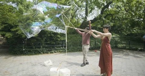 US - NYC - Central Park Bubbles 4 Stock Footage 126887525