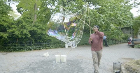US - NYC - Central Park Bubbles 5 Stock Footage 126888053