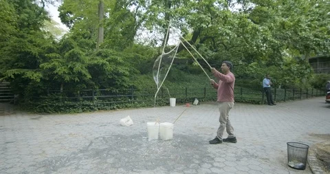 US - NYC - Central Park Bubbles 6 Stock Footage 126888389