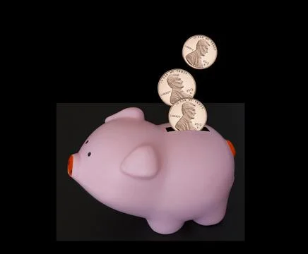 US One Cent coins falling into pink piggy bank Stock Photos