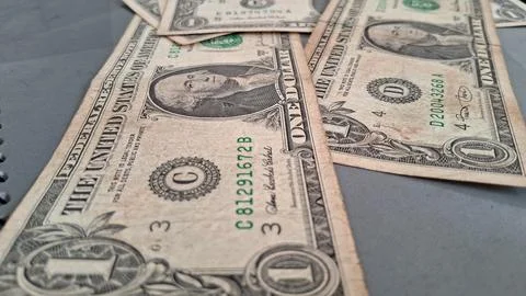 US one dollar bills on a table. American currency cash for financial business Stock Photos