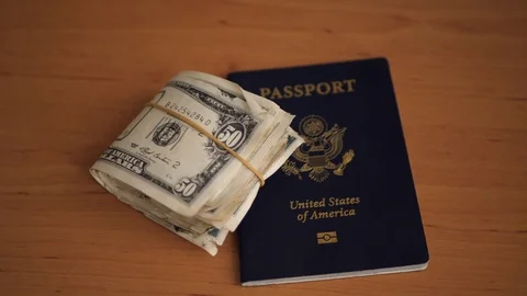 US passport and bundle of dollar bills. Stock Footage 105224048