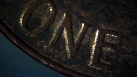 A U.S. penny seen under a microscope Stock Footage 69234126