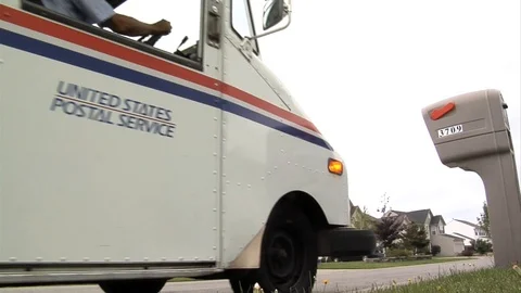 U.S. Postal vehicles deliver mail in suburban neighborhoods. Video stock 123365617