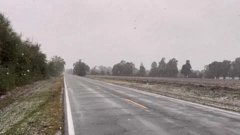 US: Rare snow falls across the Florida Panhandle in Greenwood, Florida, U... Stock Footage 327193907