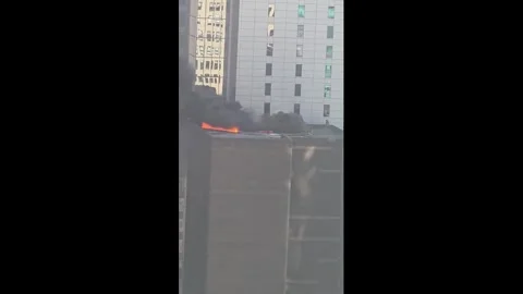 US: Rooftop Fire Breaks Out Near NYC St. Patricks Day Parade in Midtown Stock Footage 330984972