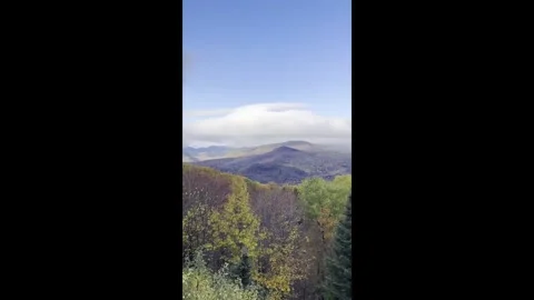 US: Scenic rainbow appears over colorful autumn foliage in Jackson, New H... Stock Footage 320654915