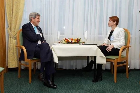 U.S. Secretary of State John Kerry sits with Estonian Foreign Minister Kei... Stock Photos