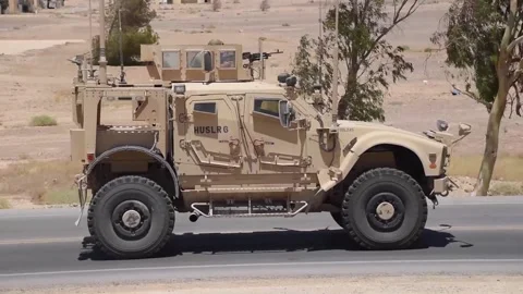 U.S. Security Forces driving Mine-Resistant Ambush Protected All-Terrain Vehicle Stock Footage 201526861