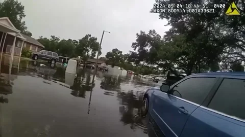 US: Sheriff's Deputies Save Driver from Floodwaters Stock Footage 285791558