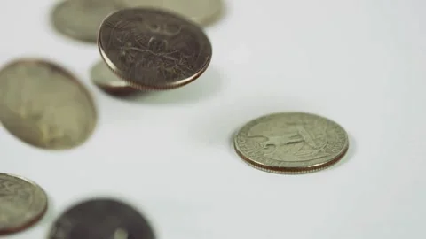 US silver coins falling and bouncing on white background Stock Footage 329595908