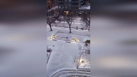 US: Snowfall Transforms Downtown Minneapolis Into Peaceful Winter Scene Stock Footage 321895169