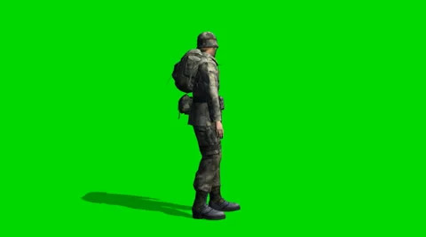 US Soldier looking around - seperated on green screen Vidéo 34023544