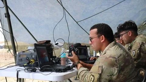 U.S. Soldier operates a laptop computer to control an unmanned aerial vehicle Stock Footage 334314337