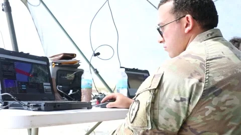 U.S. Soldier operating laptop computer to control an unmanned aerial vehicle Stock Footage 334316019