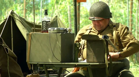 US soldiers at command post during a WWII reenactment 3 Stock Footage 38822919