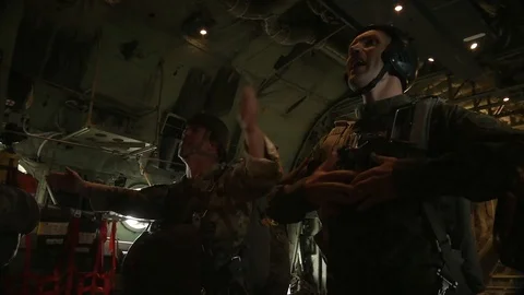 U.S. soldiers prepare to jump from a Lockheed C-130 Hercules - 2018 Stock Footage 95643498