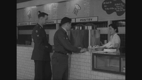 U.S. soldiers stand in queue in snack bar and sits in food court - 1960 Stock Footage 96024749