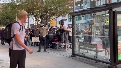 US: Three Arrested as Clashes Erupt Outside TPUSA Event at UC Berkeley Stock Footage 320933972