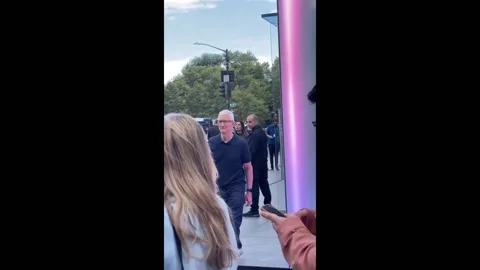 US: Tim Cook greets customer waiting in line at Apple Fifth Avenue, New York... Stock Footage 285412628