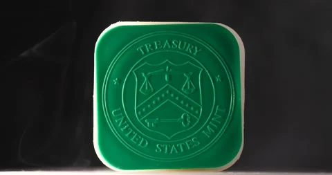 US Treasury mint tube close up isolated on black hold silver or gold Video stock 207650575