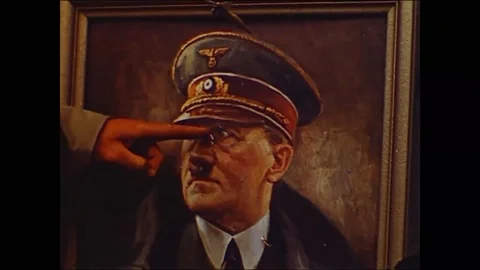 U.S. troops shows anger on Hitler photo frame - 1944 Stock Footage 98564149