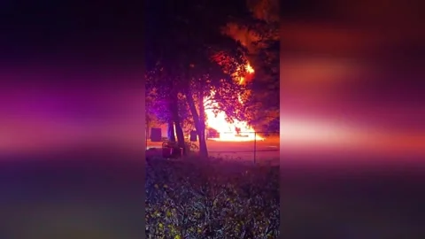 US: Two Semi Trucks Explode In Fiery Blast Outside Payson Apartments Stock Footage 323460935