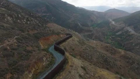 US: U.S. border wall expansion destroys sacred indigenous site Stock Footage 334189286