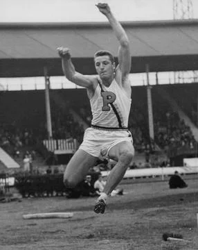 U.s.a. V English Universities Athletics At White City. Anson Perina In Action In Stock Photos