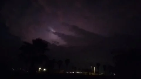 US: Wild Lightning Storm Ignites Night Sky Over Magnolia Beach In Texas Video stock 321895165