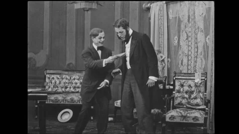 USA - 1909 - In this silent comedy a man visits his nephew, whom he believes to Stock Footage 323259926