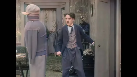 USA - 1914 - In this silent comedy, a drunk man (Charlie Chaplin) is bewildered Stock Footage 296402509
