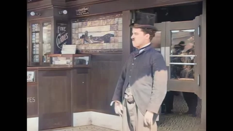USA - 1914 - In this silent comedy, a man (Charlie Chaplin) tries to fight off a Stock Footage 296404286
