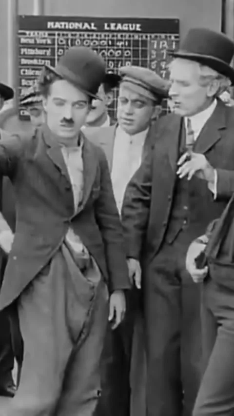 USA - 1914 - In this silent comedy, a painter (Charlie Chaplin) gets drunk at a Stock Footage 342804790