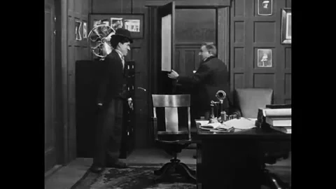 USA - 1915 - In this silent comedy, an actor (Charlie Chaplin) is hired and Stock Footage 340581002